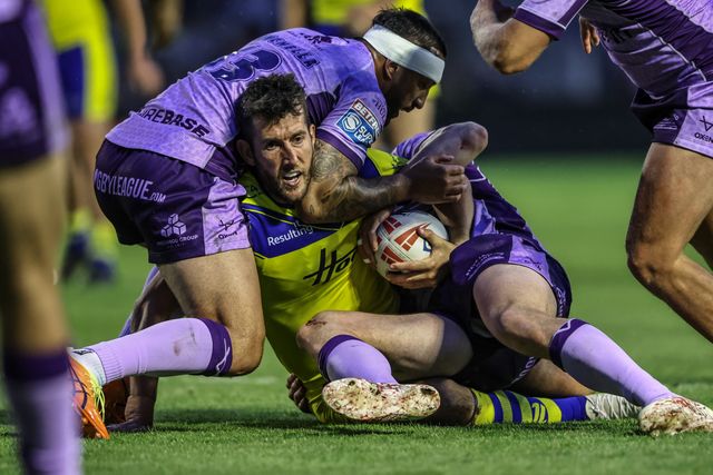 Stefan Ratchford of Warrington Wolves is tackled during the Betfred Super League Round 12 match Warrington Wolves vs Hull KR at Halliwell Jones Stadium, Warrington, United Kingdom, 23rd May 2025

(Photo by Alfie Cosgrove/News Images)