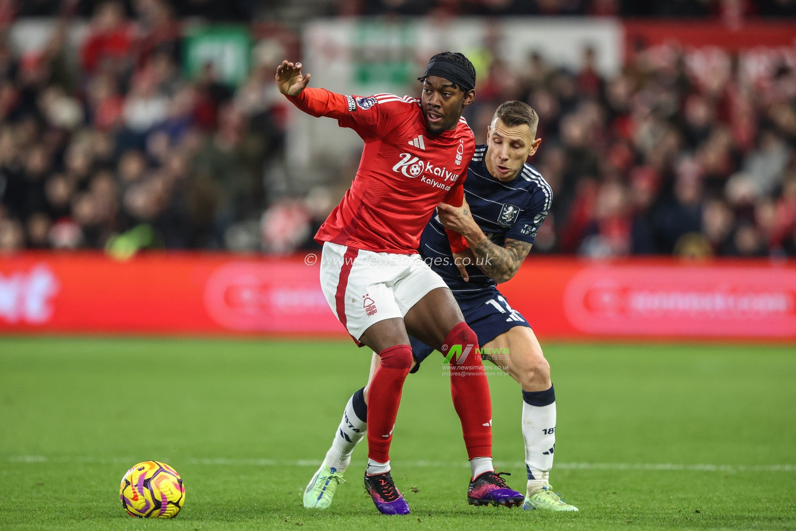 Anthony Elanga of Nottingham Forest and Lucas Digne of Aston Villa battle for the ball during the Premier League match Nottingham Forest vs Aston Villa at City Ground, Nottingham, United Kingdom, 14th December 2024

(Photo by Alfie Cosgrove/News Images)