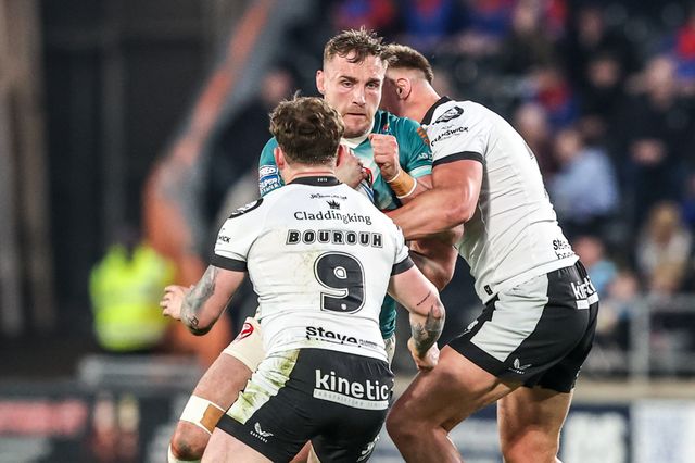 Matty Lees of St Helens is tackled by Amir Bourouh of Hull FC and Harvie Hill of Hull FC during the Betfred Super League round 8 match Hull FC vs St Helens at MKM Stadium, Hull, United Kingdom on 16 April 2026

(Photo by Alfie Cosgrove/News Images)
