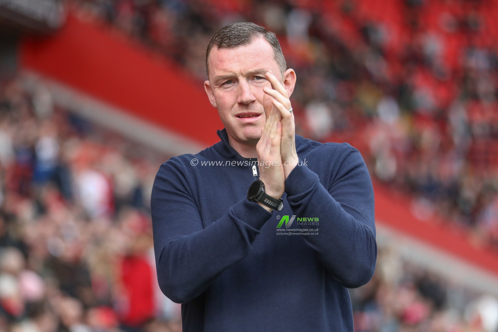 Neill Collins Head coach of Barnsley applauds the fans as he comes out for kick off during the Sky Bet League 1 match Charlton Athletic vs Barnsley at The Valley, London, United Kingdom, 6th April 2024

(Photo by Alfie Cosgrove/News Images)