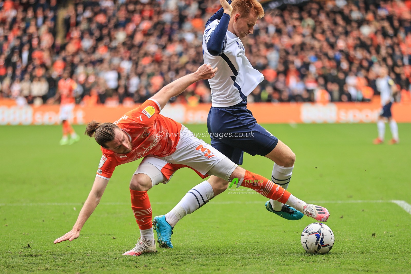 James Husband #3 of Blackpool and Sepp van den Berg #2 of Preston North End tangle in the area, no foul, play on