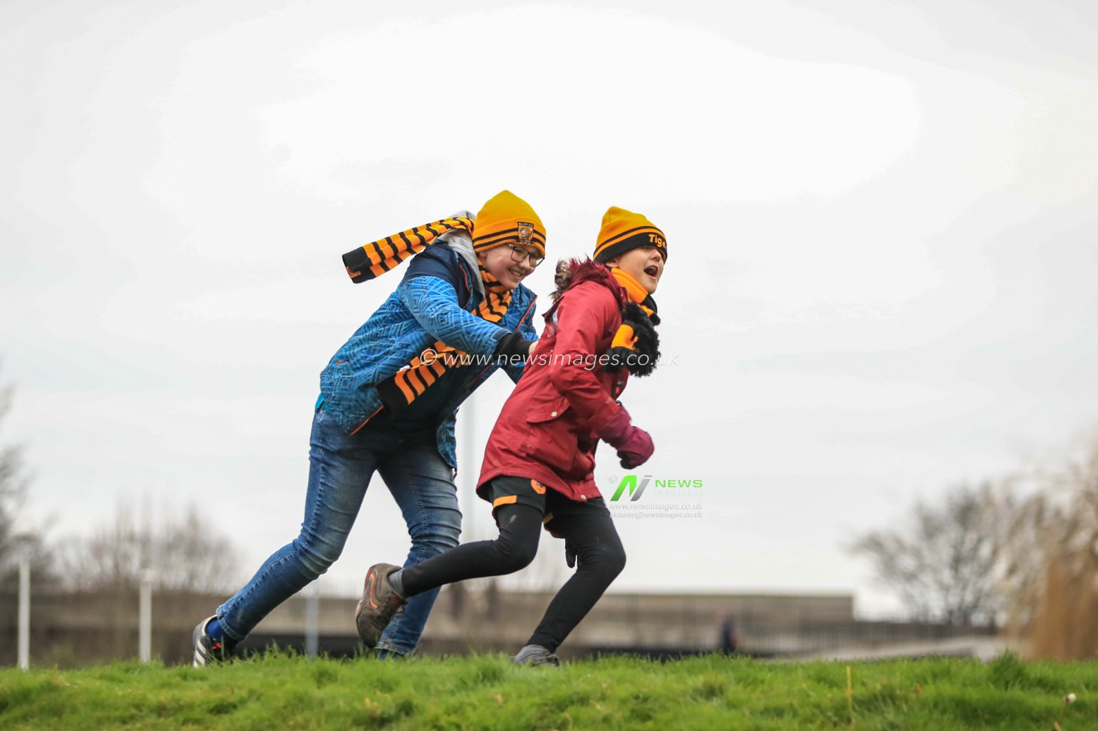 25th January 2020, KC Stadium, Kingston upon Hull, England; Emirates FA Cup, Hull City v Chelsea : Two young Hull fans play outside the ground before kick-off