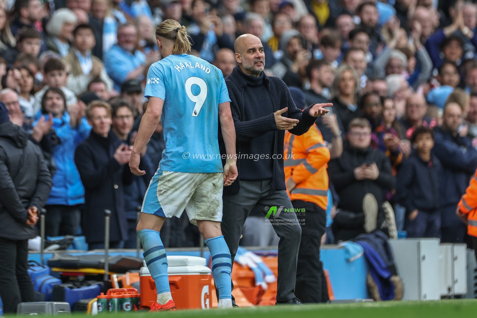 Pep Guardiola manager of Manchester City speaks to Erling Haaland  of Manchester City as he comes off during the Premier League match Manchester City vs Wolverhampton Wanderers at Etihad Stadium, Manchester, United Kingdom, 4th May 2024

(Photo by Mark Cosgrove/News Images)