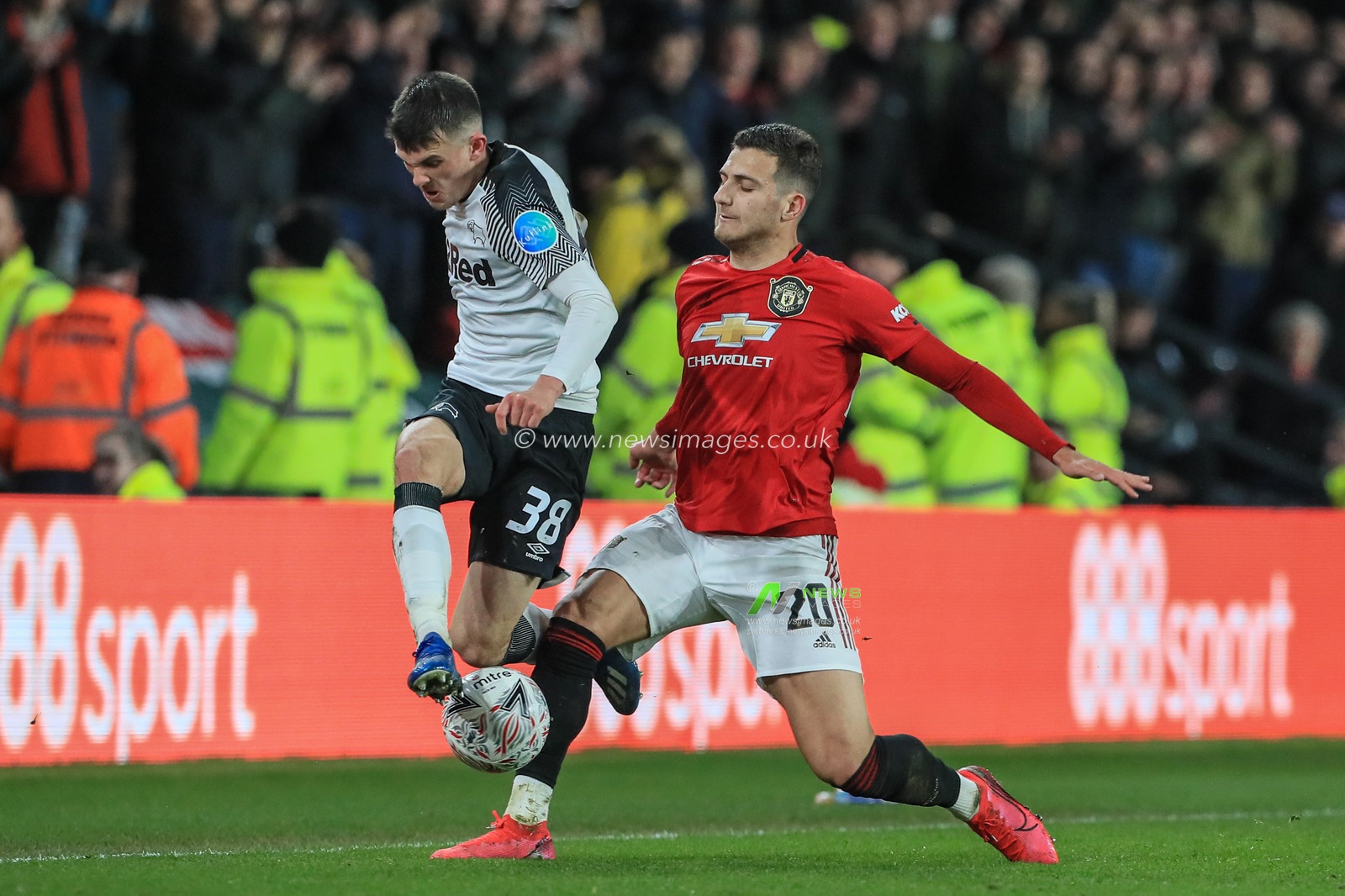 5th March 2020, Pride Park Stadium, Derby, England; Emirates FA Cup 5th Round, Derby County v Manchester United : Jason Knight (38) of Derby County is tackled by Diogo Dalot (20) of Manchester United