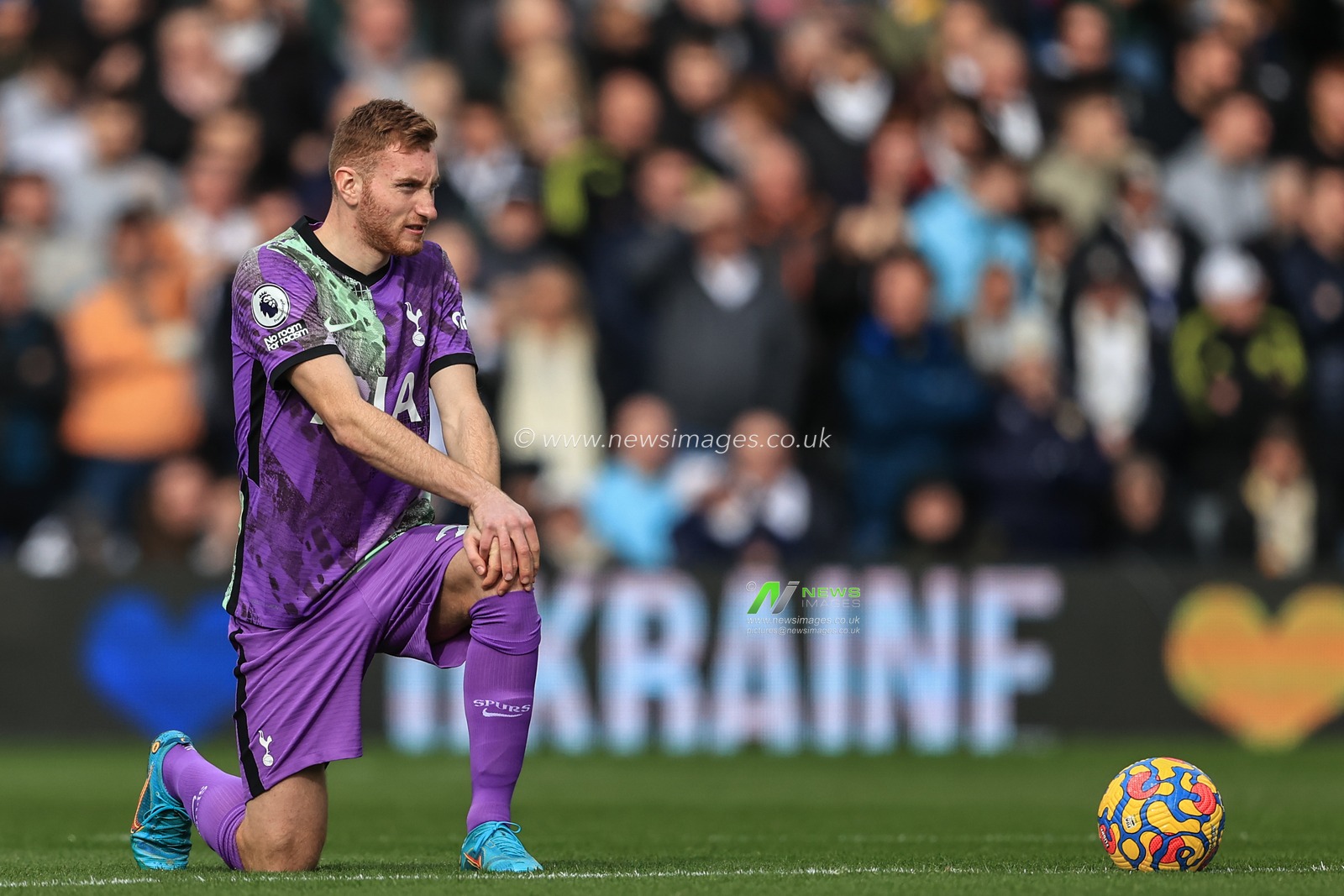 Dejan Kulusevski #21 of Tottenham Hotspur takes the knee