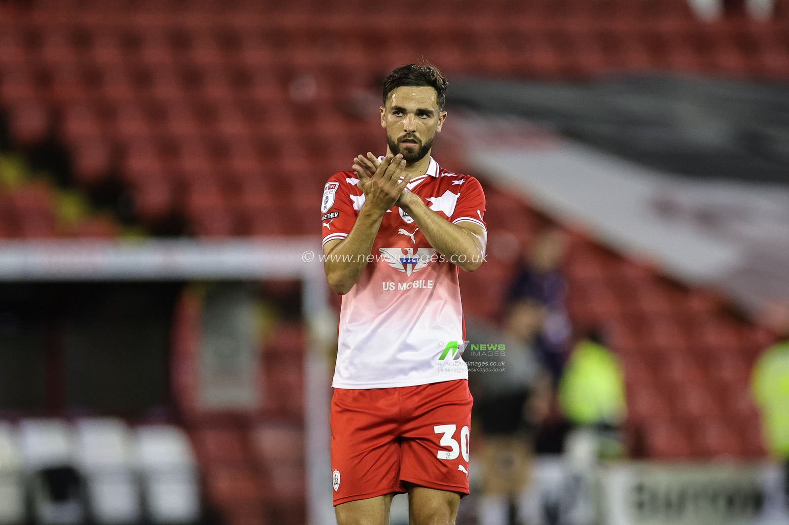 Adam Phillips #30 of Barnsley applauds the home fans during the Sky Bet League 1 match Barnsley vs Peterborough at Oakwell, Barnsley, United Kingdom, 15th August 2023

(Photo by Mark Cosgrove/News Images)