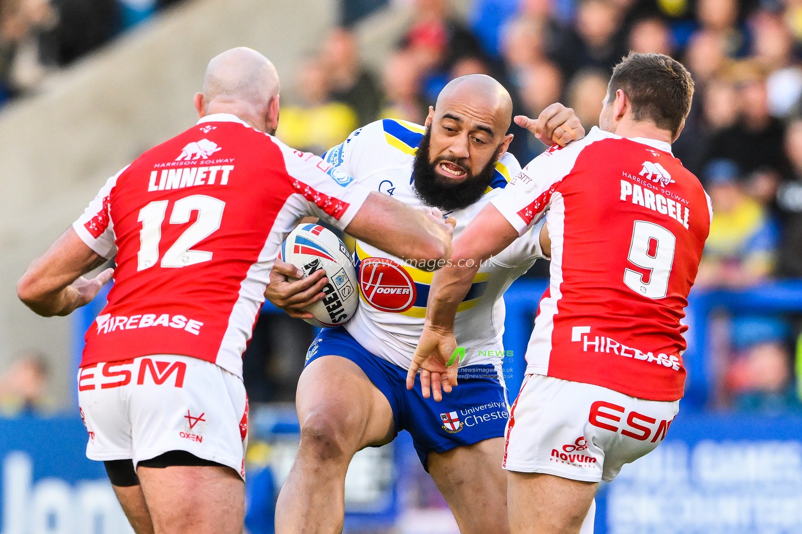 Sam Kasiano #14 of Warrington Wolves is tackled by Matt Parcell #9 and Kane Linnett #12 of Hull KR  during the Betfred Super League Round 12 match Warrington Wolves vs Hull KR at Halliwell Jones Stadium, Warrington, United Kingdom, 12th May 2023

(Photo by Craig Thomas/News Images)