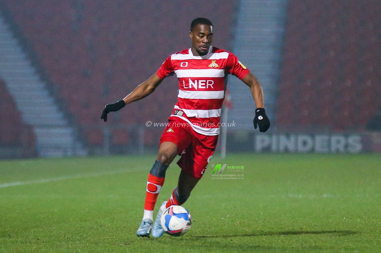 Fejiri Okenabirhie #9 of Doncaster Rovers in action during the game
