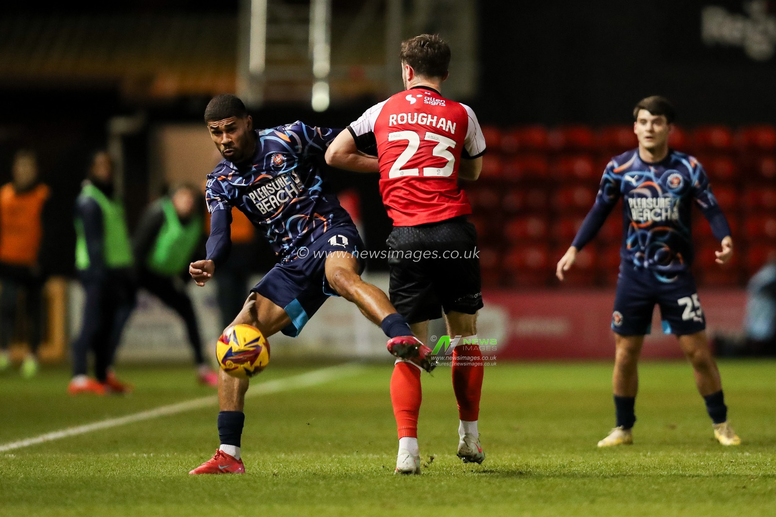 Ashley Fletcher of Blackpool battles for the ball with Sean Roughan of Lincoln City during the Sky Bet League 1 match Lincoln City vs Blackpool at Gelder Group Sincil Bank Stadium, Lincoln, United Kingdom, 28th January 2025

(Photo by Izzy Poles/News Images)