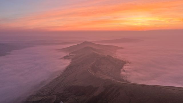 Sunrise hikers walk to the summit of Mam Tor as they watch the sunrise and admire the cloud inversion in the Hope Valley at Mam Tor in the Peak District at Mam Tor, Castleton, United Kingdom on 21 March 2026

(Photo by Mark Cosgrove/News Images)