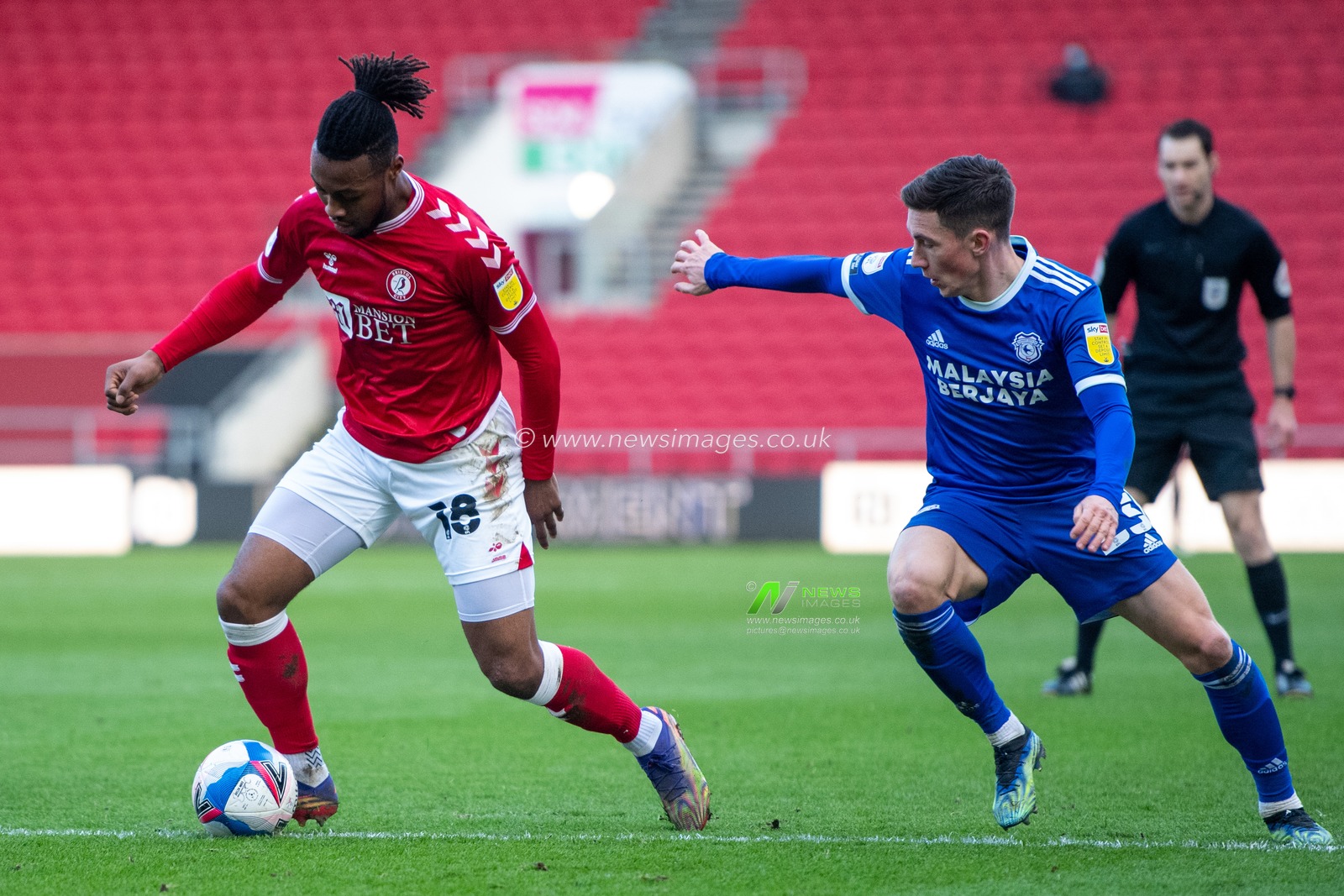 Antoine Semenyo #18 of Bristol City takes the ball passed Harry Wilson #23 of Cardiff City into the Cardiff area