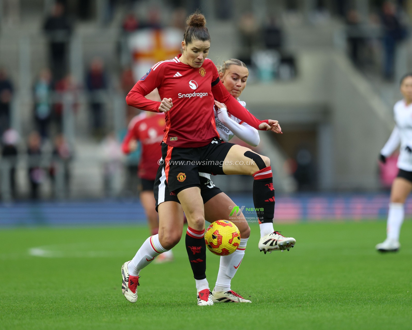 Dominique Janssen of Manchester United is put under pressure by Zara Shaw of Liverpool during the Barclays Women's Super League match Manchester United Women vs Liverpool Women at Leigh Sports Village, Leigh, United Kingdom, 8th December 2024

(Photo by Alex Roebuck/News Images)