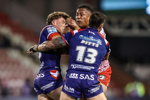 Tesi Niu of Leigh Leopards is tackled during the Betfred Super League play-off Eliminator 1 match Leigh Leopards vs Wakefield Trinity at Progress With Unity Stadium, Leigh, United Kingdom, 26th September 2025

(Photo by Alfie Cosgrove/News Images)