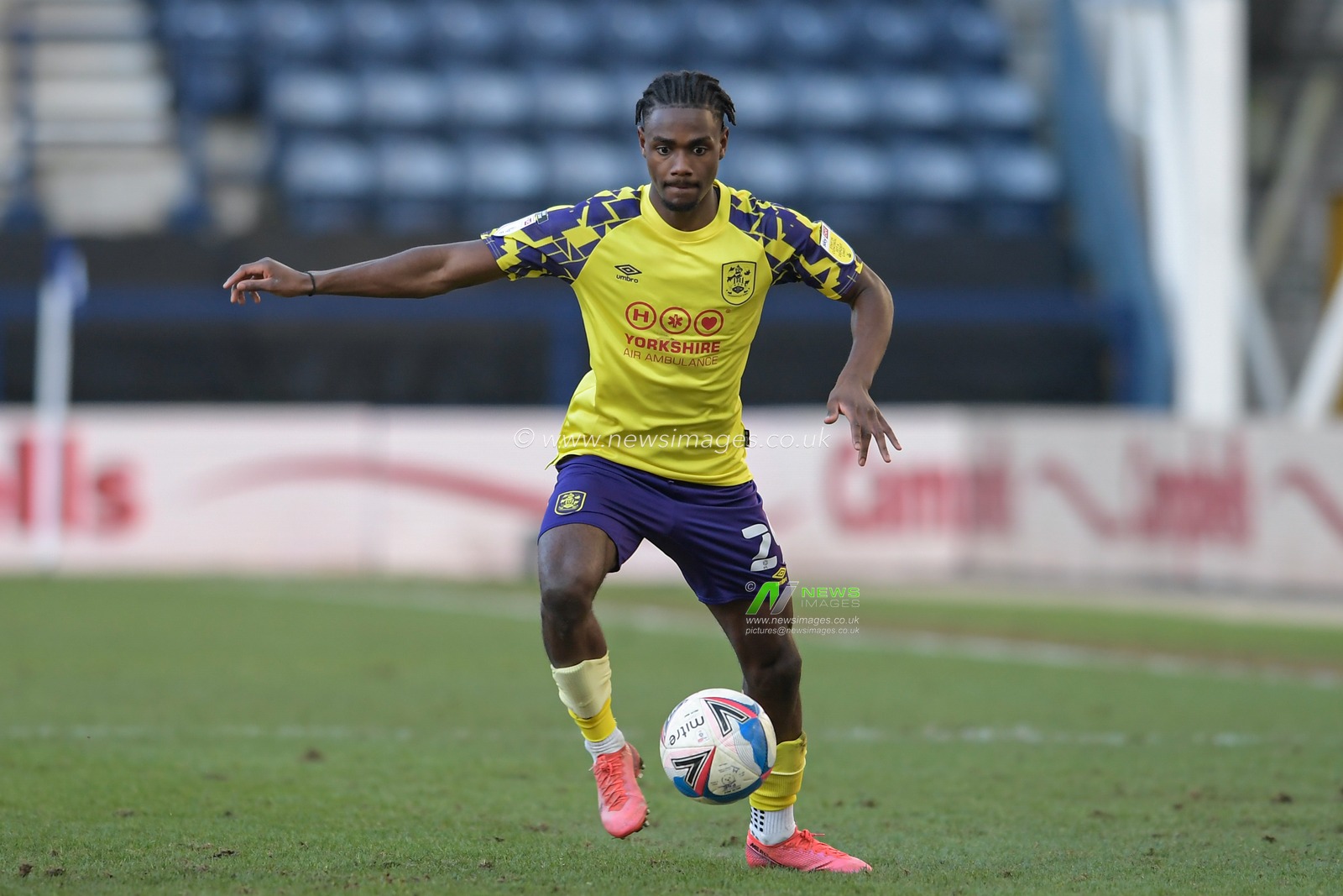 Aaron Rowe #29 of Huddersfield Town controls the ball