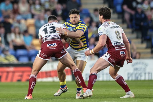 Joe Philbin of Warrington Wolves is tackled by Kaide Ellis of Wigan Warriors during the Betfred Super League round 9 match Warrington Wolves vs Wigan Warriors at The Halliwell Jones Stadium, Warrington, United Kingdom on 24 April 2026

(Photo by Mark Cosgrove/News Images)