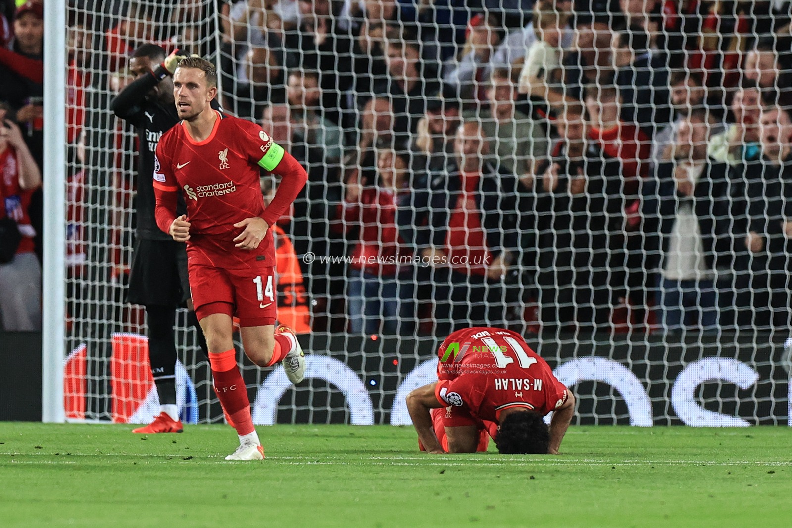 Mohamed Salah #11 of Liverpool bows down after scoring to make it 2-2