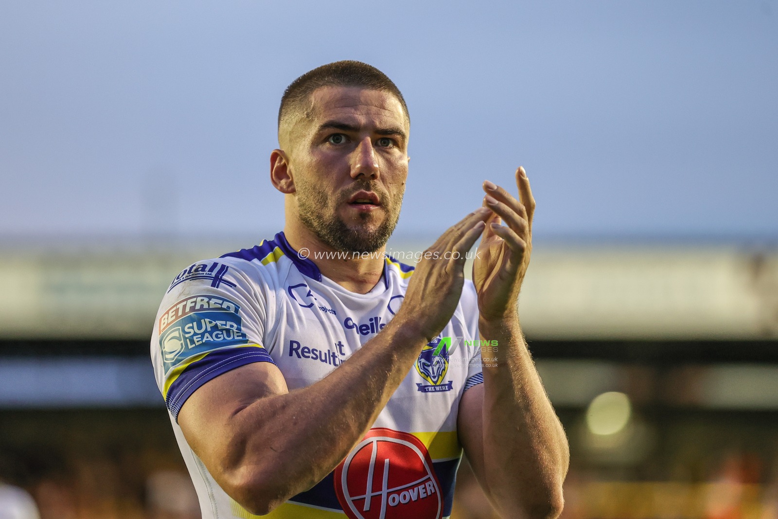 Greg Minikin #21 of Warrington Wolves applauds the traveling fans during the Betfred Super League Round 16 match Castleford Tigers vs Warrington Wolves at The Mend-A-Hose Jungle, Castleford, United Kingdom, 23rd June 2023

(Photo by Mark Cosgrove/News Images)