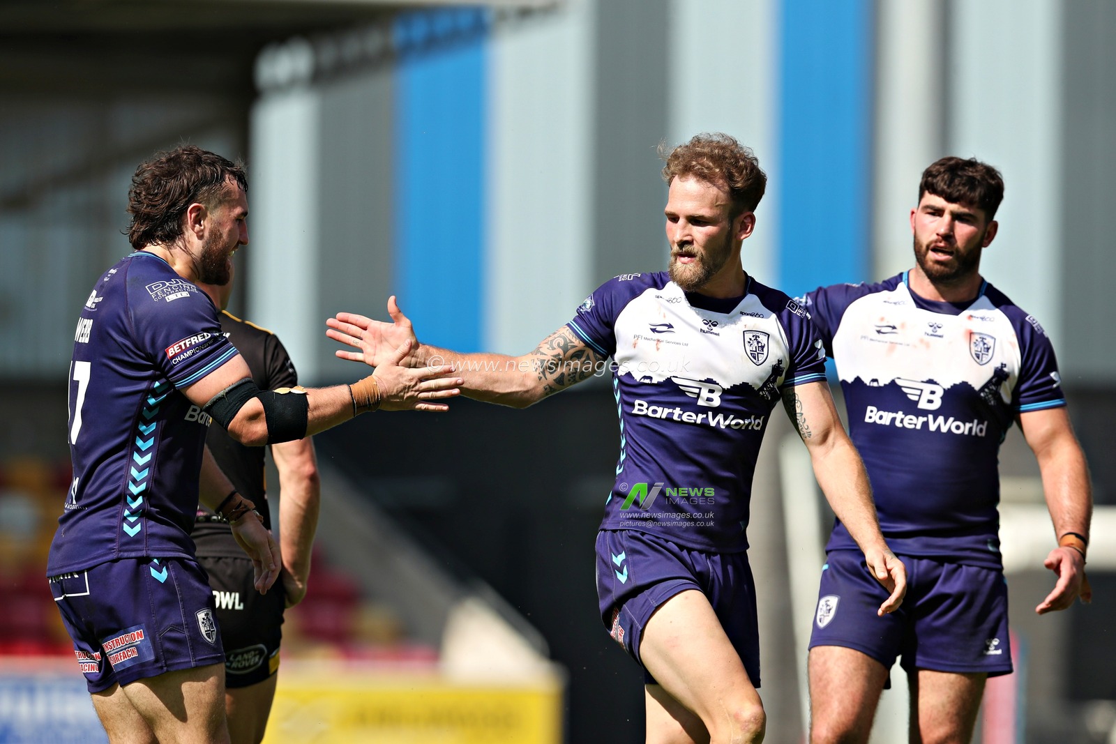 Ben Reynolds of Featherstone Rovers high fives Clay Webb of Featherstone Rovers during the Betfred Championship match York City Knights vs Featherstone Rovers at LNER Community Stadium, York, United Kingdom, 29th June 2025(Photo by Sam Eaden/News Images)