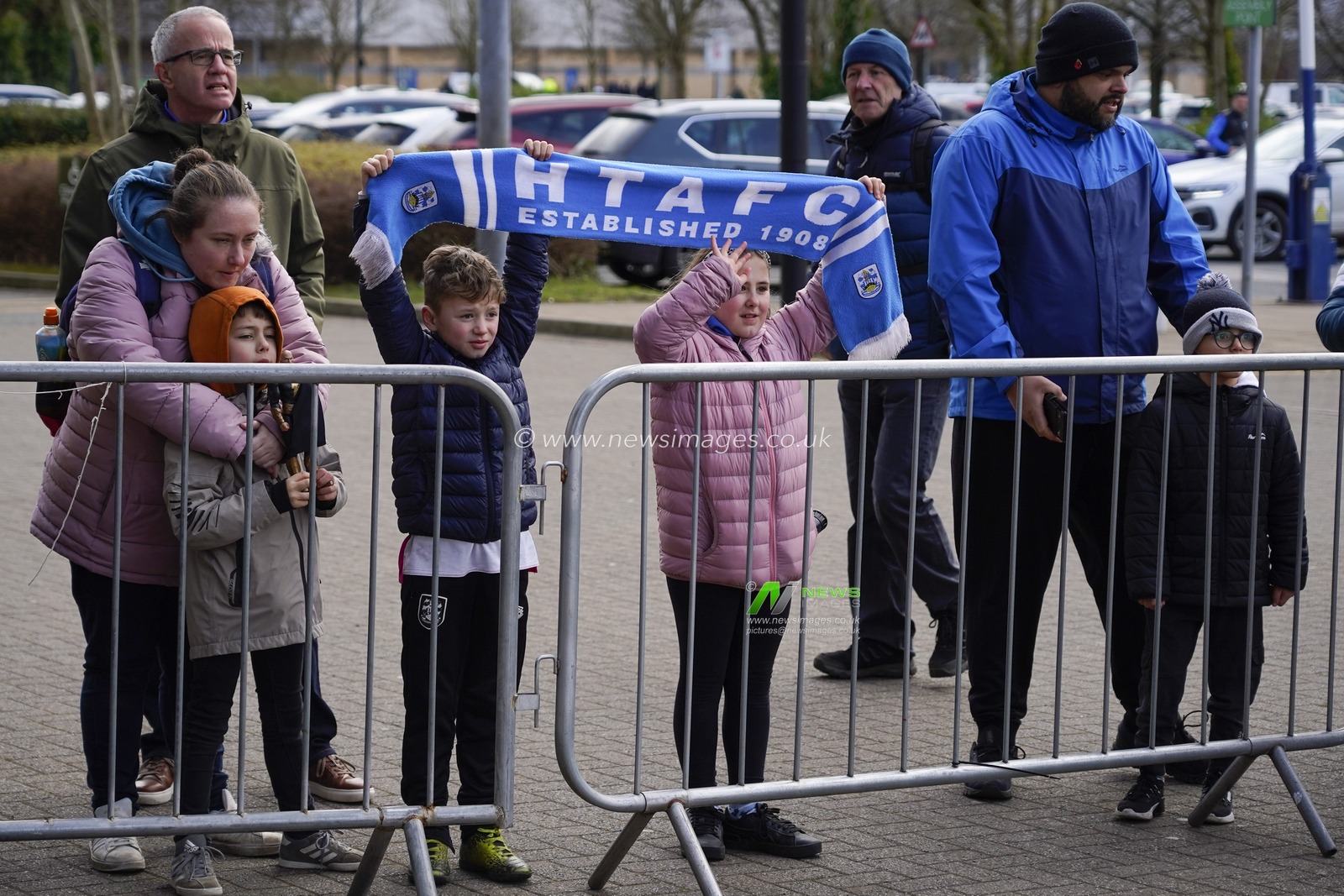 Young Terriers fans welcome their team as they arrive before the Sky Bet Championship match Wigan Athletic vs Huddersfield Town at DW Stadium, Wigan, United Kingdom, 11th February 2023

(Photo by Steve Flynn/News Images)