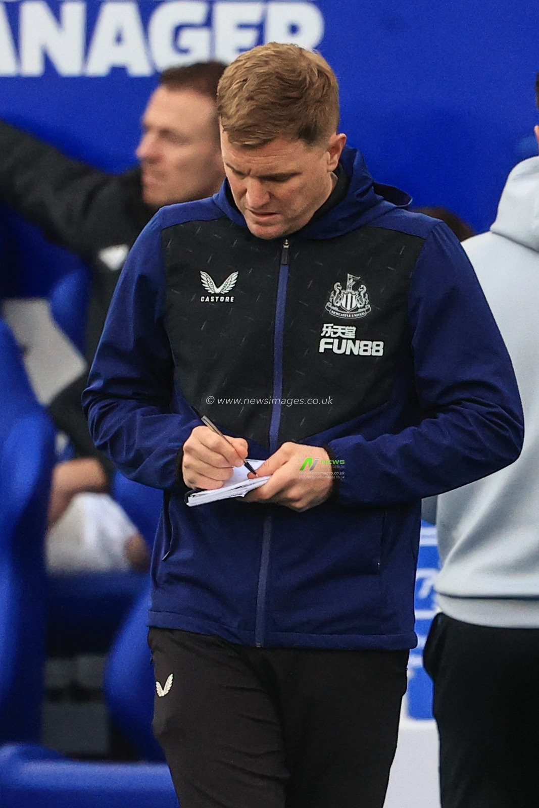 Eddie Howe manager of Newcastle United takes notes during the game