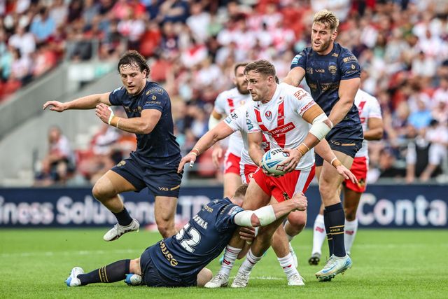 Matty Lees of St. Helens is tackled during the Betfred Super League round 16 match St Helens vs Salford Red Devils at Totally Wicked Stadium, St Helens, United Kingdom, 29th June 2025

(Photo by Alfie Cosgrove/News Images)