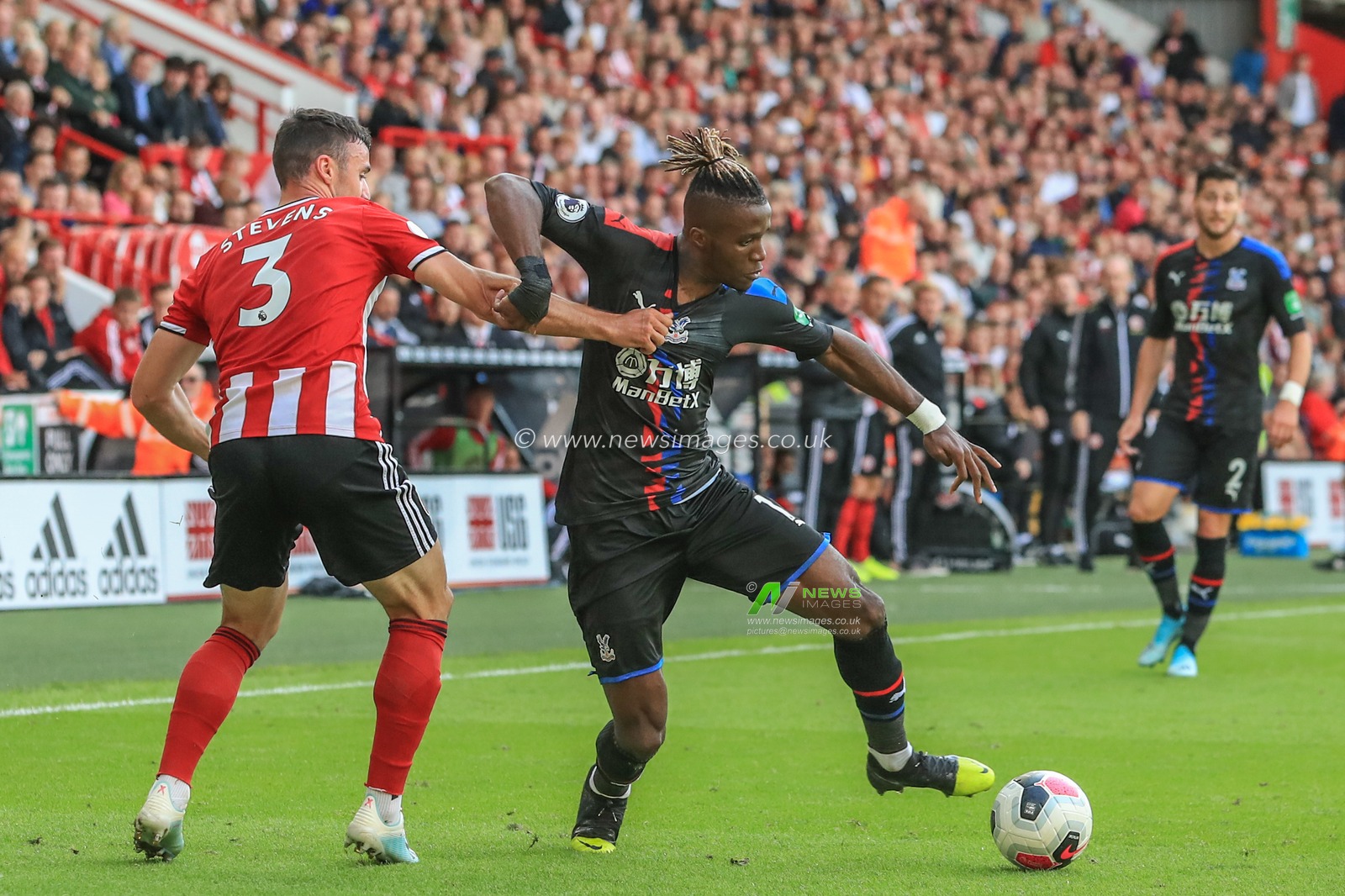 18th August 2019 , Bramall Lane, Sheffield, England; Premier League Football, Sheffield United vs Crystal Palace ; Wilfried Zaha (11) of Crystal Palace dribbles past Enda Stevens (3) of Sheffield United 


Credit: Mark Cosgrove/News Images

English Football League images are subject to DataCo Licence