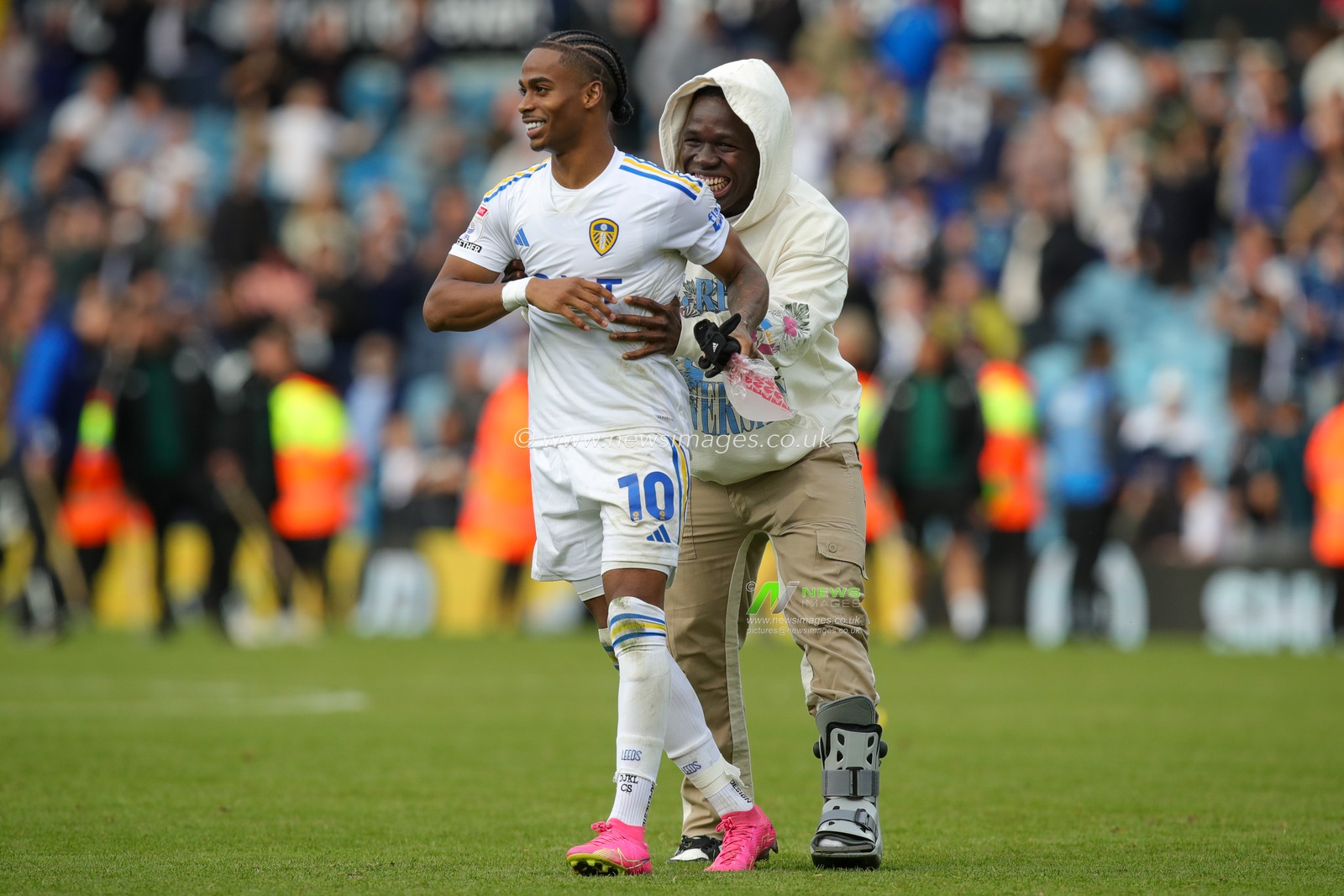 An injured Wilfried Gnonto #29 of Leeds United jokes with his team mate Crysencio Summerville #10 of Leeds United at full time after the Sky Bet Championship match Leeds United vs Watford at Elland Road, Leeds, United Kingdom, 23rd September 2023

(Photo by James Heaton/News Images)