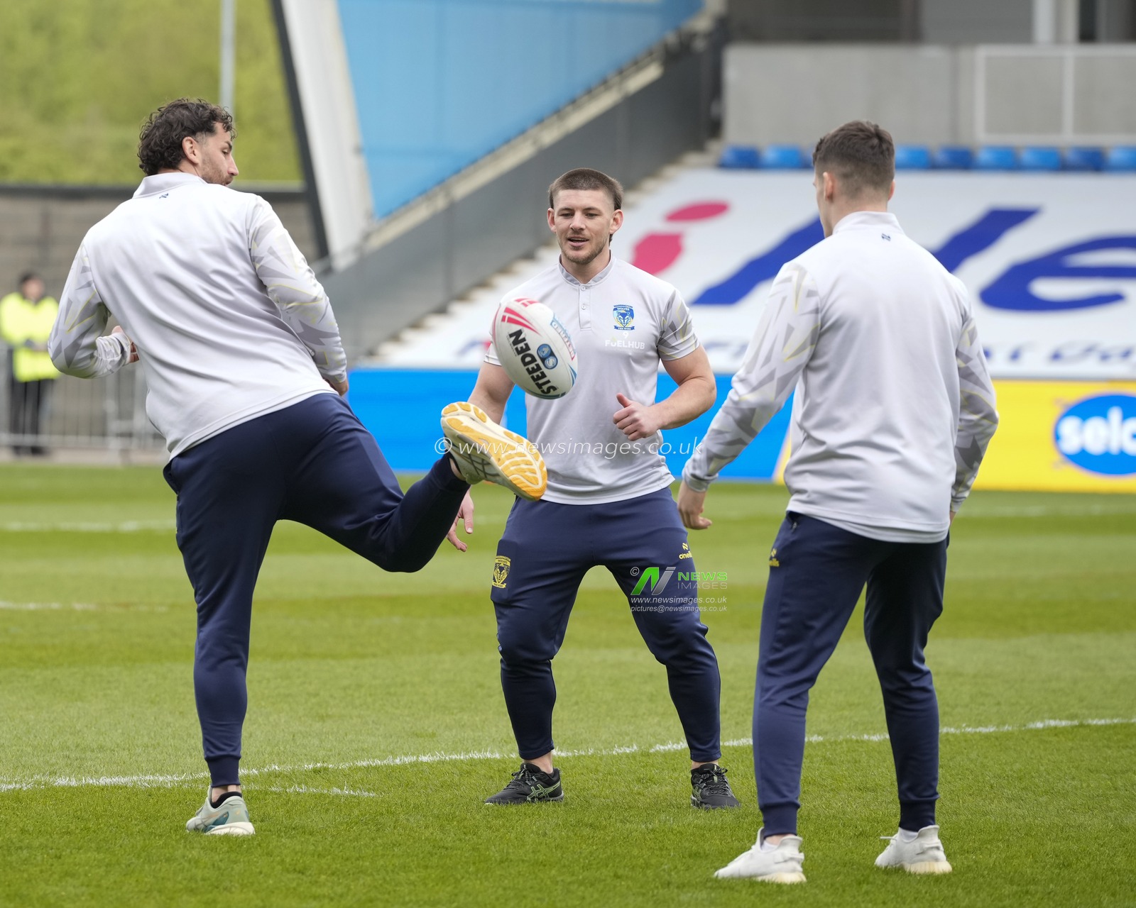 Toby King, Danny Walker and Josh Thewlis of Warrington Wolves kick a ball about as they inspect the pitch before the Betfred Super League Round 9 match Salford Red Devils vs Warrington Wolves at Salford Community Stadium, Eccles, United Kingdom, 27th April 2024

(Photo by Steve Flynn/News Images)