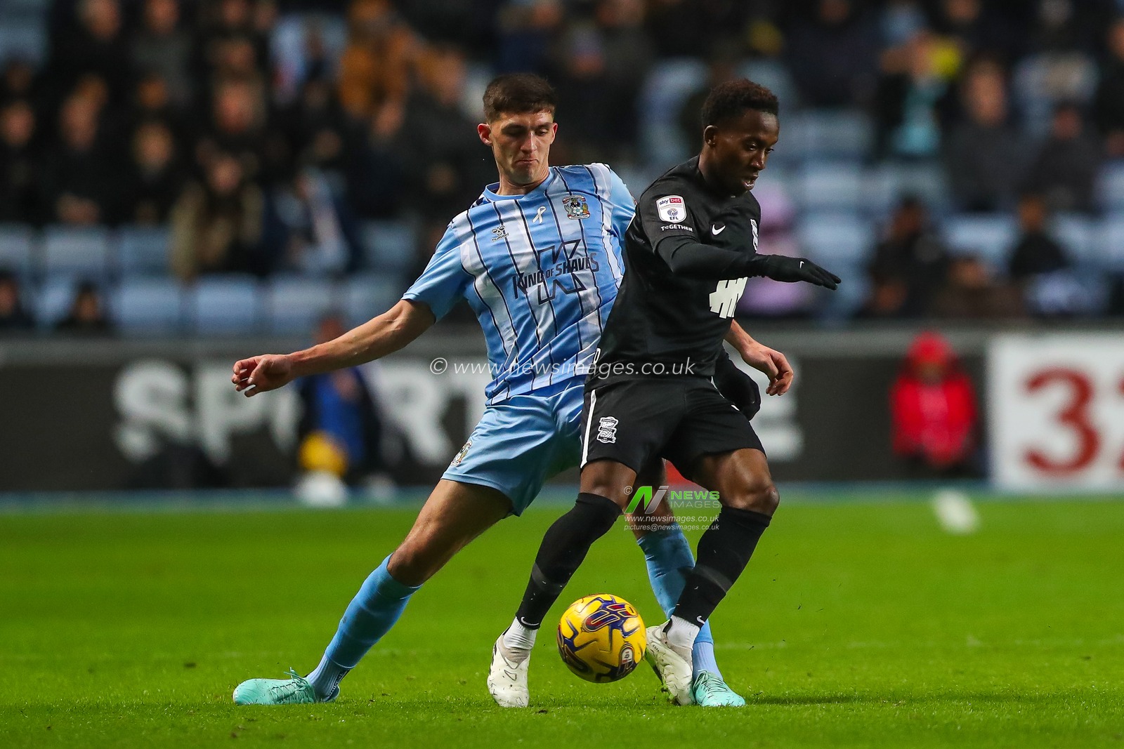 Siriki DembÃ©lÃ© #17 of Birmingham City is tackled by Bobby Thomas #4 of Coventry City during the Sky Bet Championship match Coventry City vs Birmingham City at Coventry Building Society Arena, Coventry, United Kingdom, 8th December 2023

(Photo by Gareth Evans/News Images)