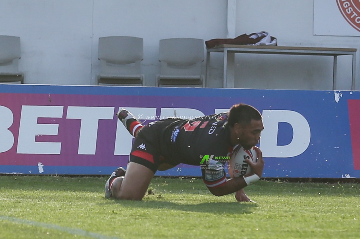 Ken Sio (2) of Salford Red Devils goes over for a try