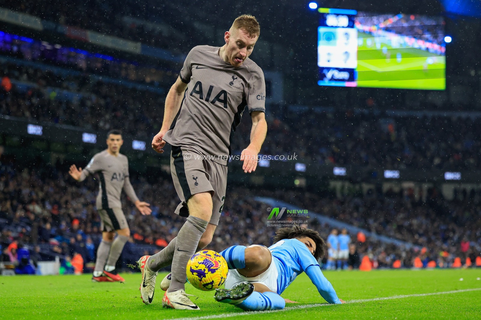 Rico Lewis #82 of Manchester City tackles Dejan Kulusevski #21 of Tottenham Hotspur during the Premier League match Manchester City vs Tottenham Hotspur at Etihad Stadium, Manchester, United Kingdom, 3rd December 2023

(Photo by Conor Molloy/News Images)