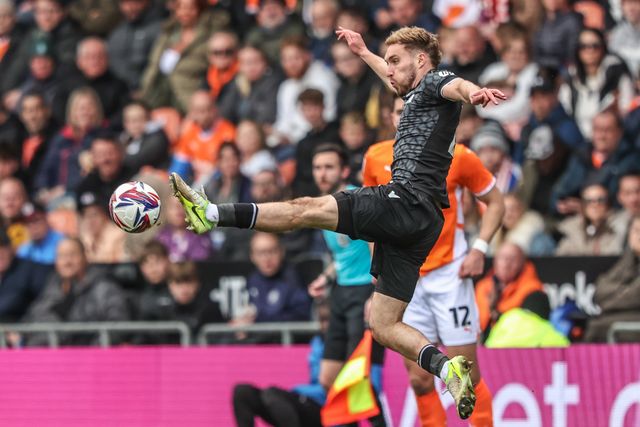 Sam Smith of Wrexham jumps up to win the high ball during the Sky Bet League 1 match Blackpool vs Wrexham at Bloomfield Road, Blackpool, United Kingdom, 21st April 2025

(Photo by Alfie Cosgrove/News Images)