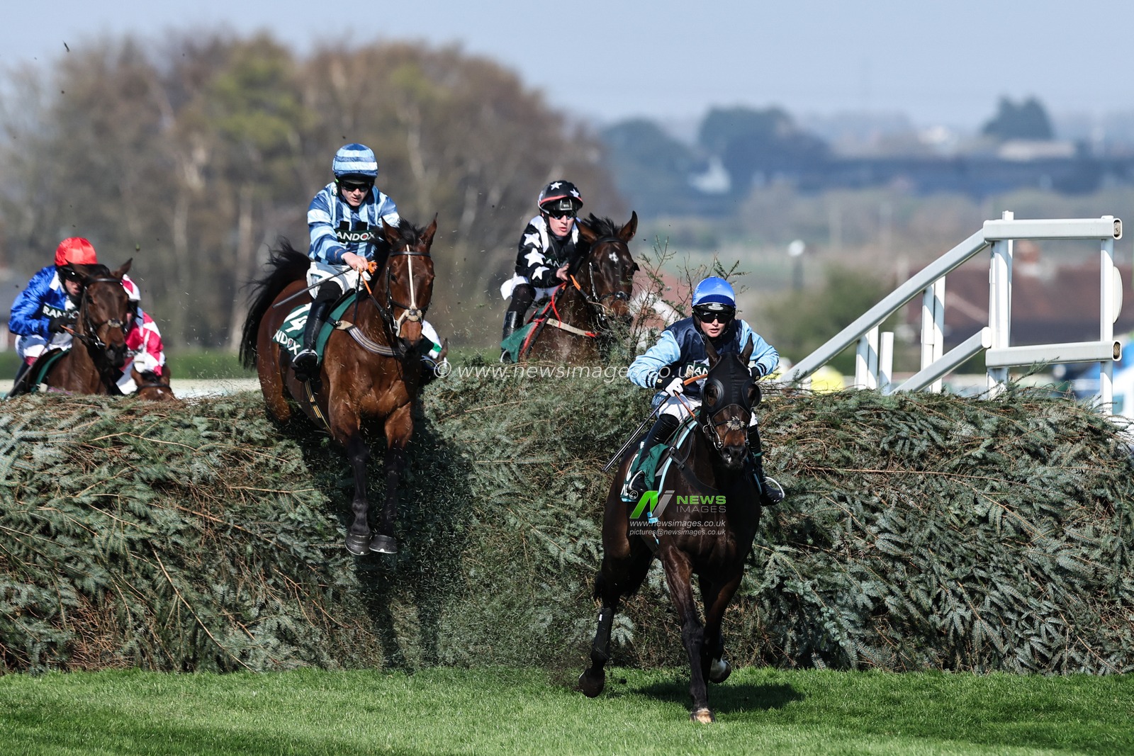 Horses clear the first fence in the Randox Foxhunters' Open Hunters' Chase during the Randox Grand National 2025 Day 1 Opening Day at Aintree Racecourse, Liverpool, United Kingdom, 3rd April 2025

(Photo by Mark Cosgrove/News Images)