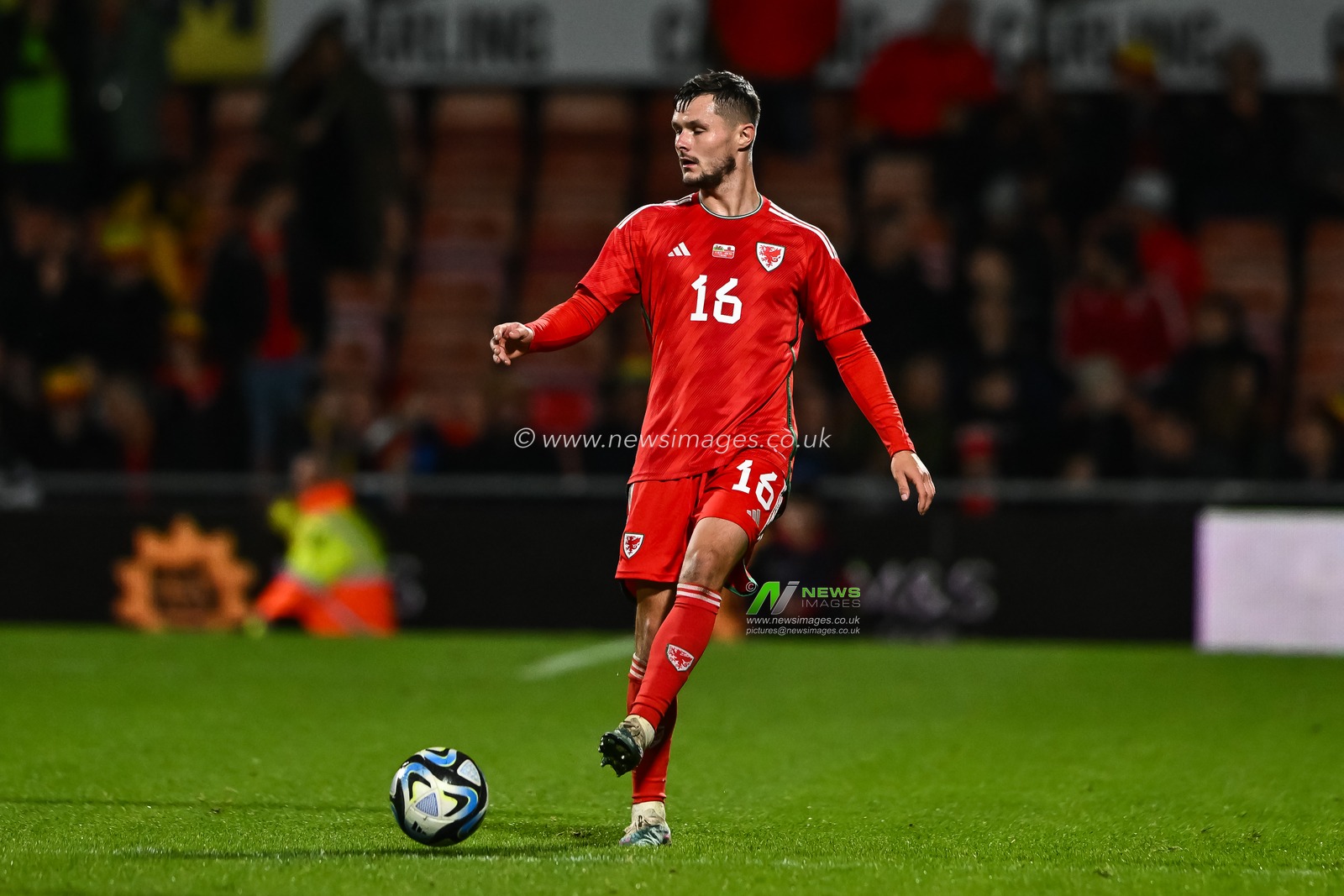 Liam Cullen of Wales passes the ballduring the International Friendly match Wales vs Gibraltar at SToK Cae Ras, Wrexham, United Kingdom, 11th October 2023

(Photo by Craig Thomas/News Images)