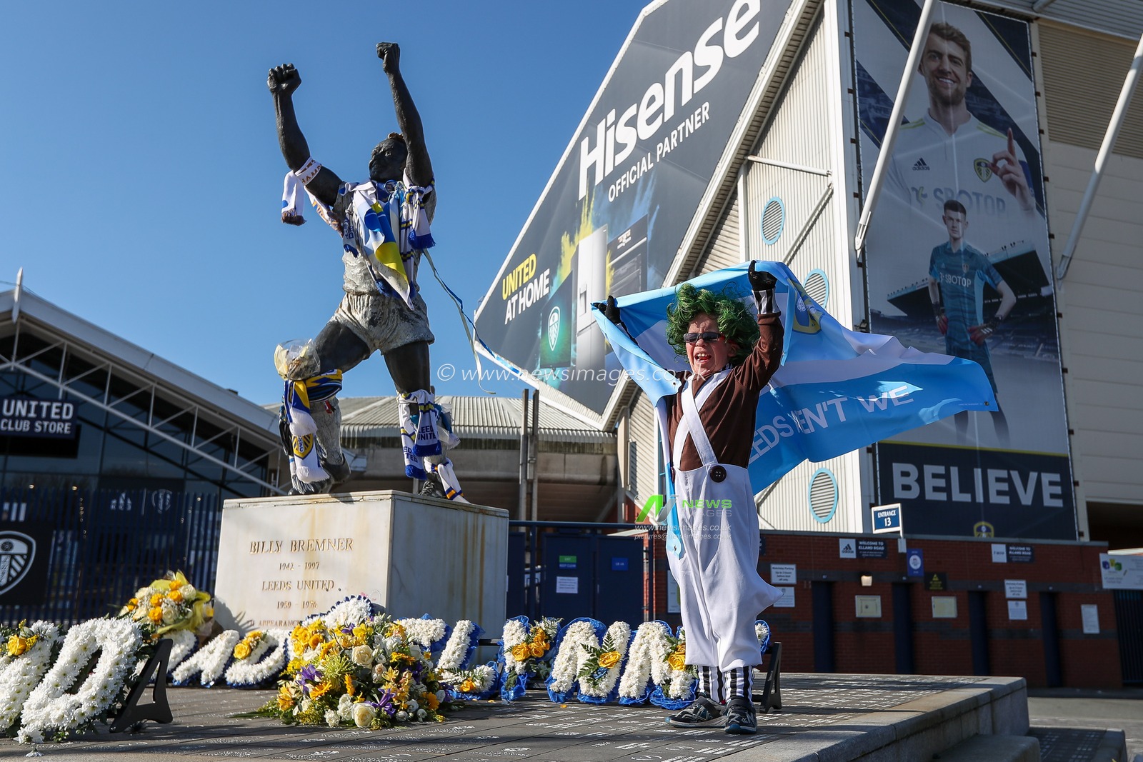 A young Leeds United supporter holds up the Argentina flag outside Elland Road Stadium in support of Marcelo Bielsa after he was sacked by the club this morning