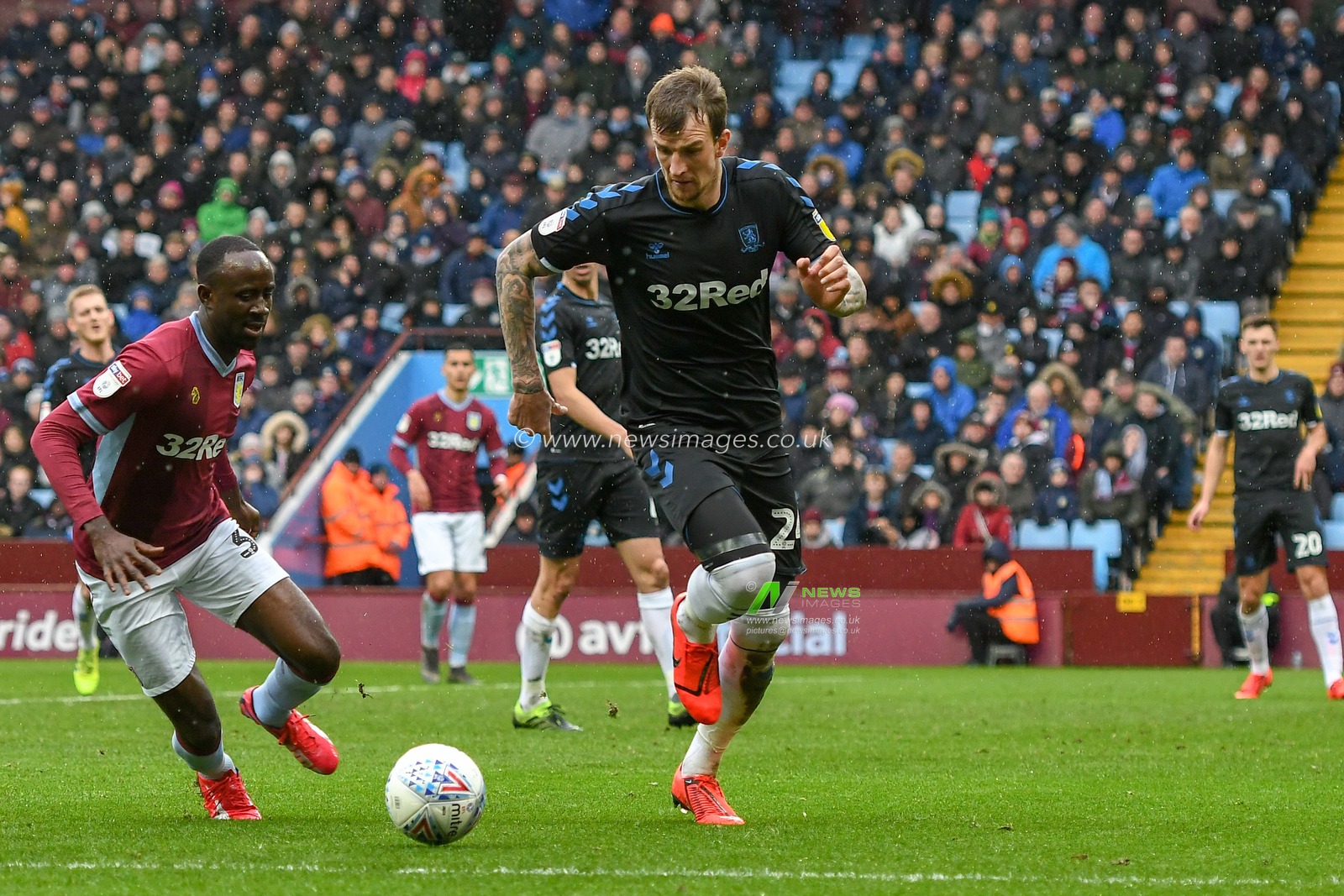 16th March 2019, Villa Park, Birmingham, England ; Sky Bet Championship, Aston Villa v Middlesbrough : Albert Adomah (37) of Aston Villa chases down the ball in possesion of Aden Flint (24) of Middlesbrough 

Credit: Gareth Dalley/News Images

English Football League images are subject to DataCo Licence