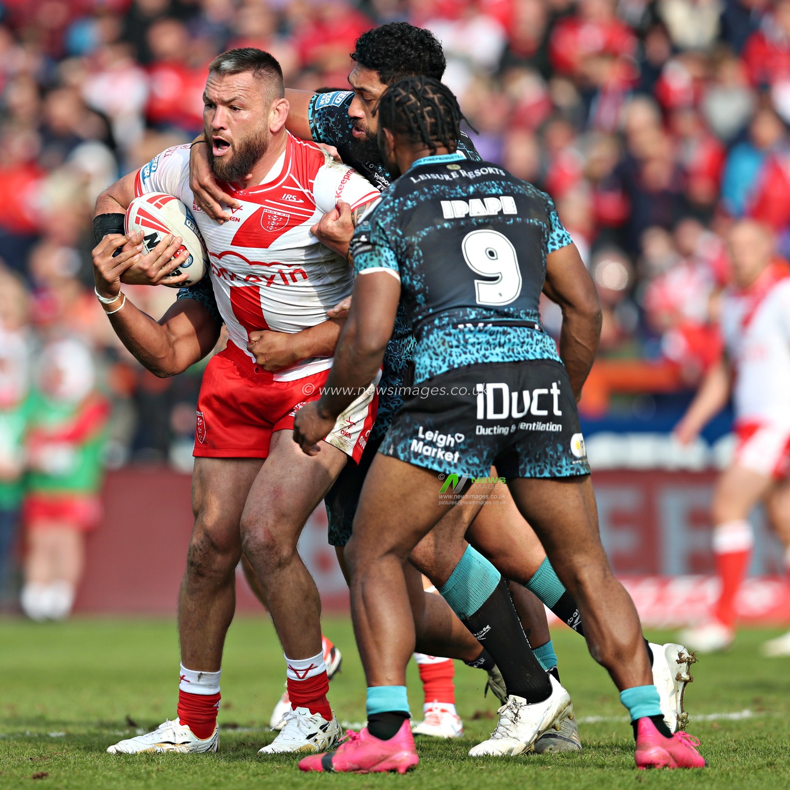 Jared Warea-Hargreaves of Hull KR is tackled by Edwin Ipape of Leigh Leopards and Isaac Liu of Leigh Leopards during the Betfred Super League Round 5 match Hull KR vs Leigh Leopards at Sewell Group Craven Park, Kingston upon Hull, United Kingdom, 22nd March 2025

(Photo by Sam Eaden/News Images)