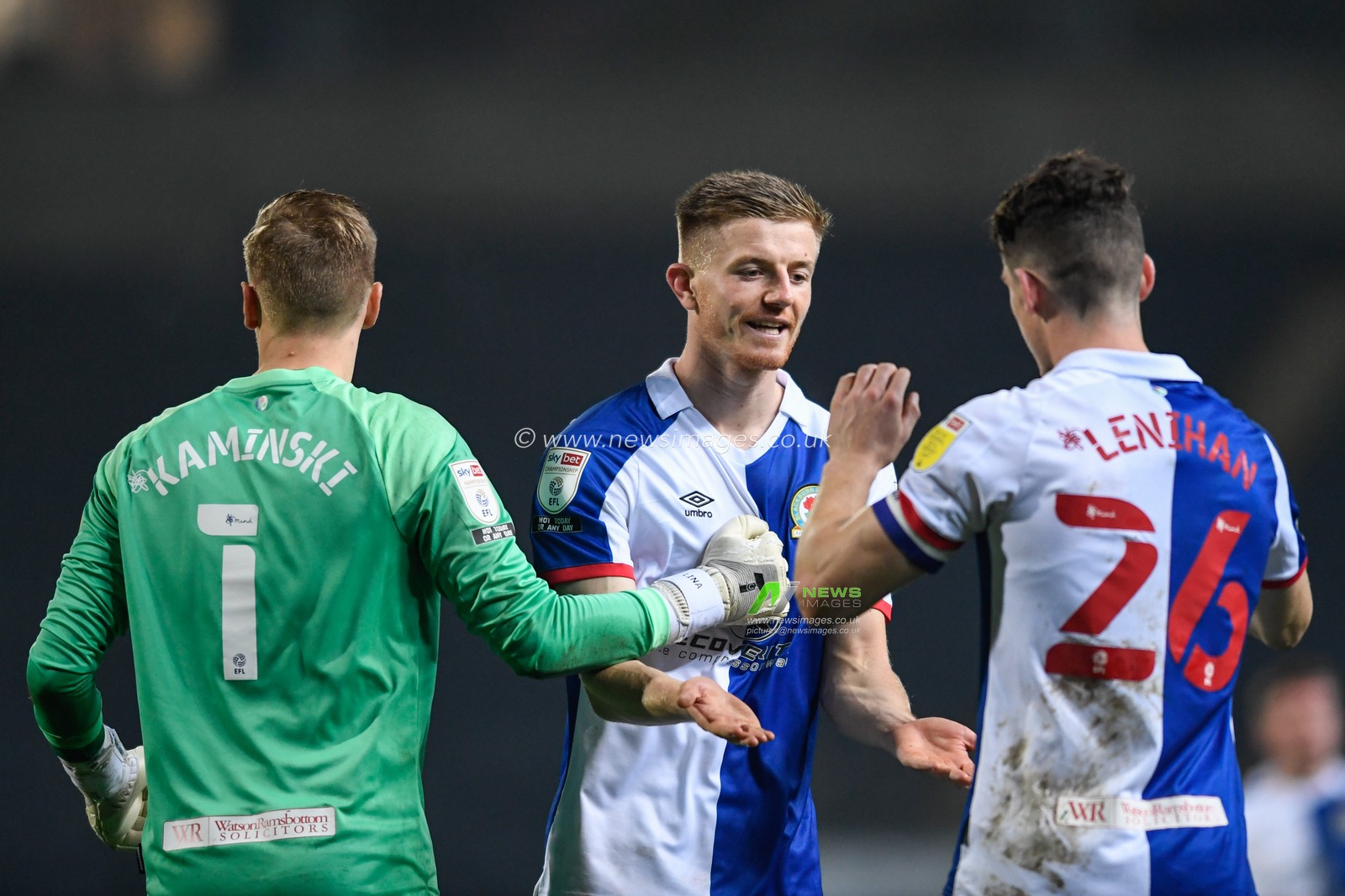 Scott Wharton #28 of Blackburn Rovers celebrates winning the game with team mates Thomas Kaminski #1 and Darragh Lenihan #26