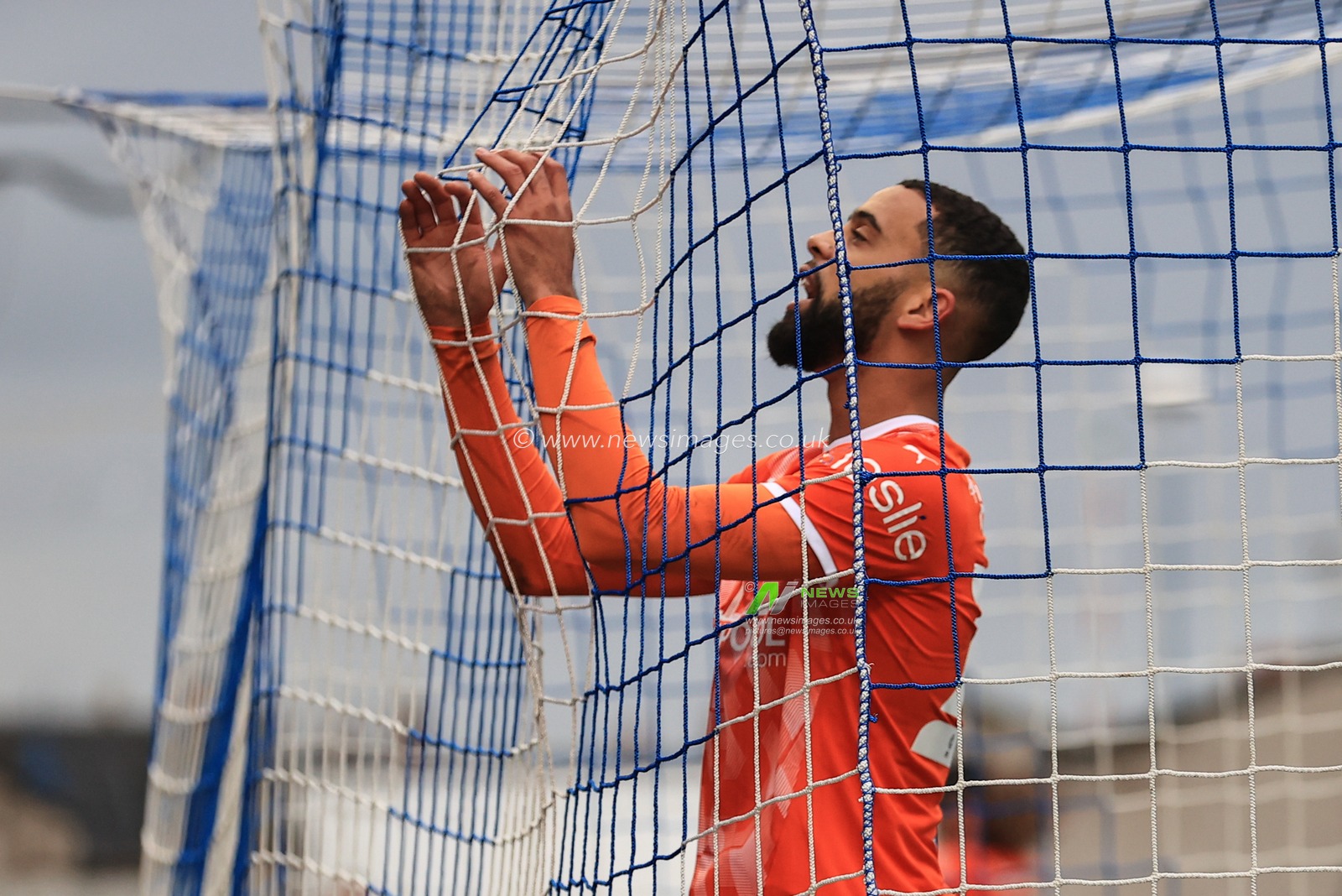 Cj Hamilton #22 of Blackpool reacts after missing a chance on goal