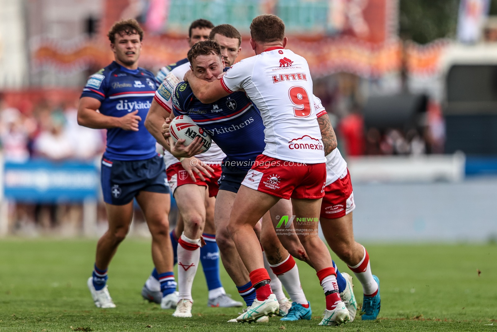 Jake Trueman of Wakefield Trinity is tackled by Jez Litten of Hull KR during the Betfred Super League round 18 match Hull KR vs Wakefield Trinity at Sewell Group Craven Park, Hull, United Kingdom on 11 July 2026

(Photo by Alfie Cosgrove/News Images)