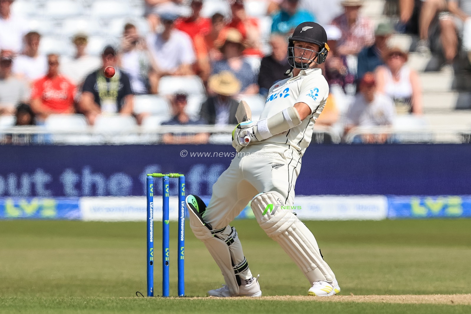 Matt Henery of New Zealand dodges a ball from Stuart Broad of England