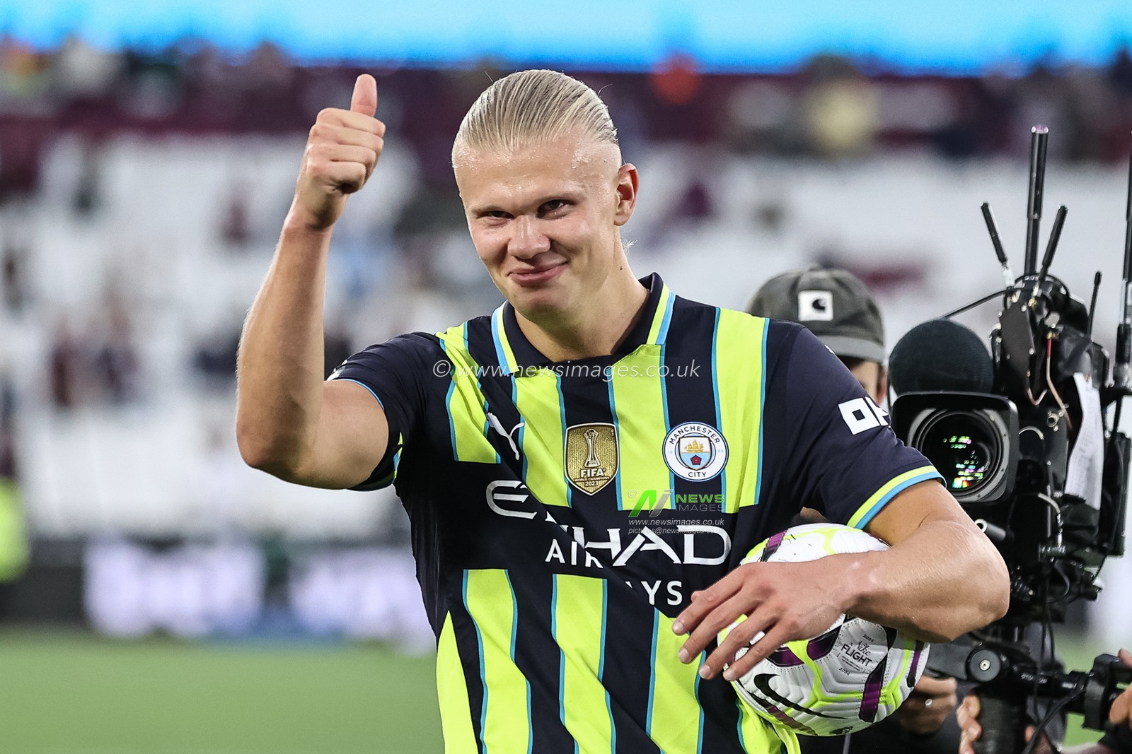 Erling Haaland of Manchester City gives the thumbs up to the traveling fans as the hat trick hero collects the match ball during the Premier League match West Ham United vs Manchester City at London Stadium, London, United Kingdom, 31st August 2024

(Photo by Mark Cosgrove/News Images)