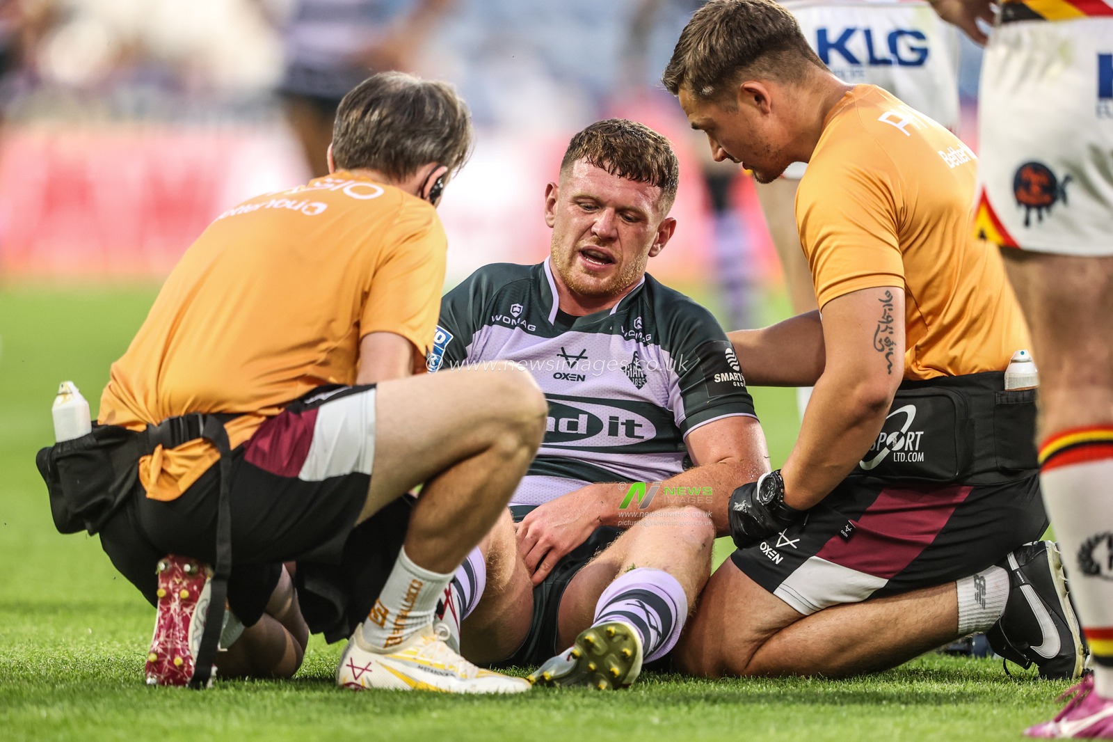 Physio treat Olly Russell of Huddersfield Giants as he is injured during the Betfred Super League round 18 match Huddersfield Giants vs Bradford Bulls at Accu Stadium, Huddersfield, United Kingdom on 10 July 2026

(Photo by Alfie Cosgrove/News Images)