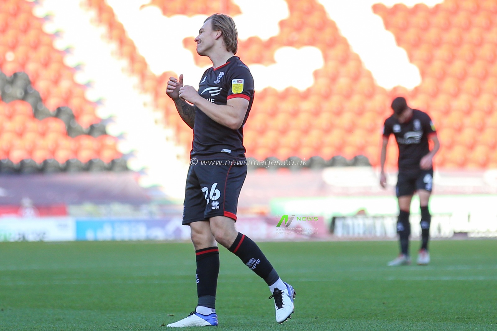 Harry Anderson (26) of Lincoln City in action during the game