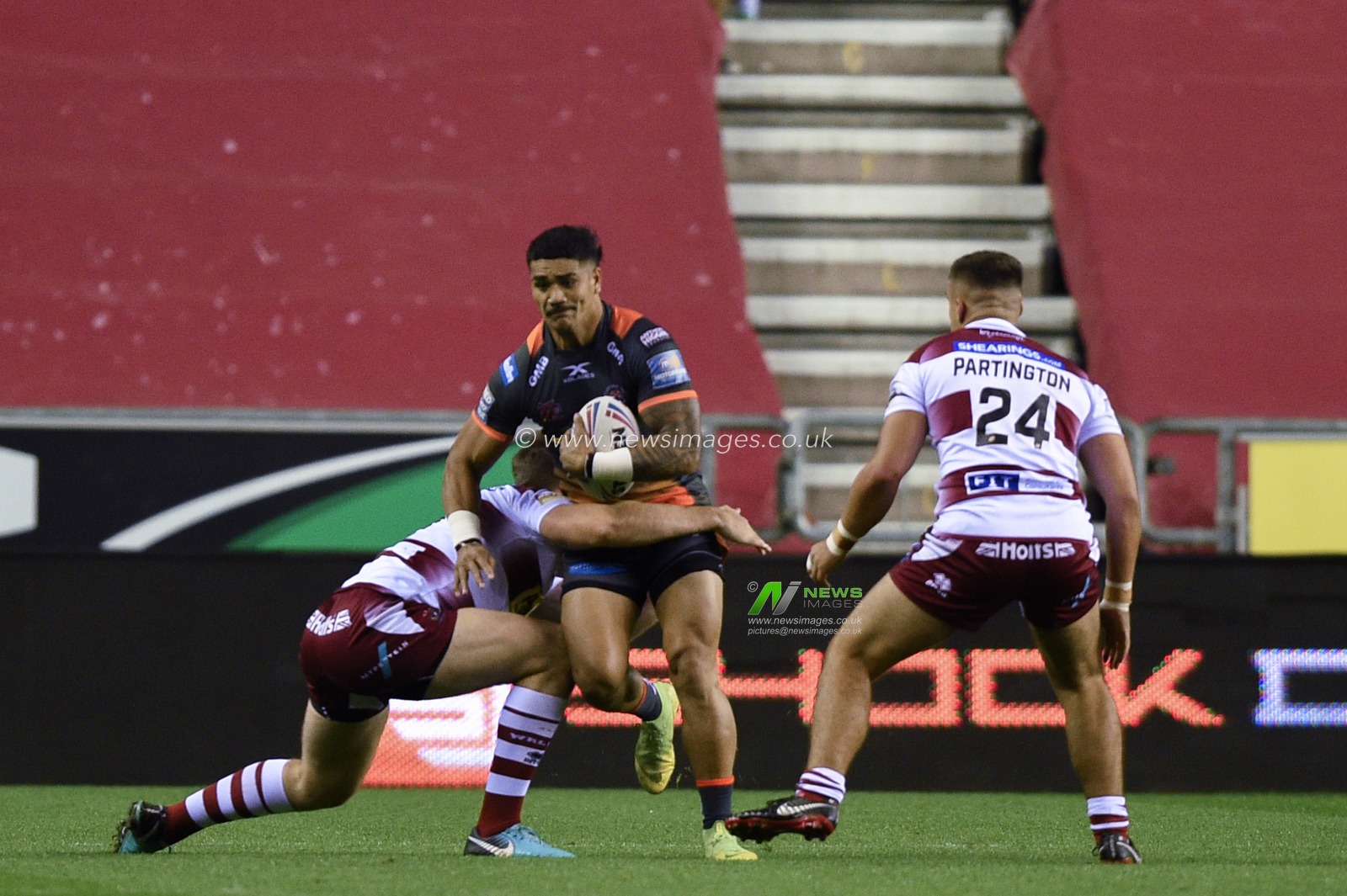 12th September 2019 , DW Stadium, Wigan, England;  Betfred Super League Rugby, Round 29, Wigan Warriors vs Castleford Tigers ; Peter Mataâ€™utia (1) of Castleford Tigers is tackled 

Credit: Richard Long/News Images
