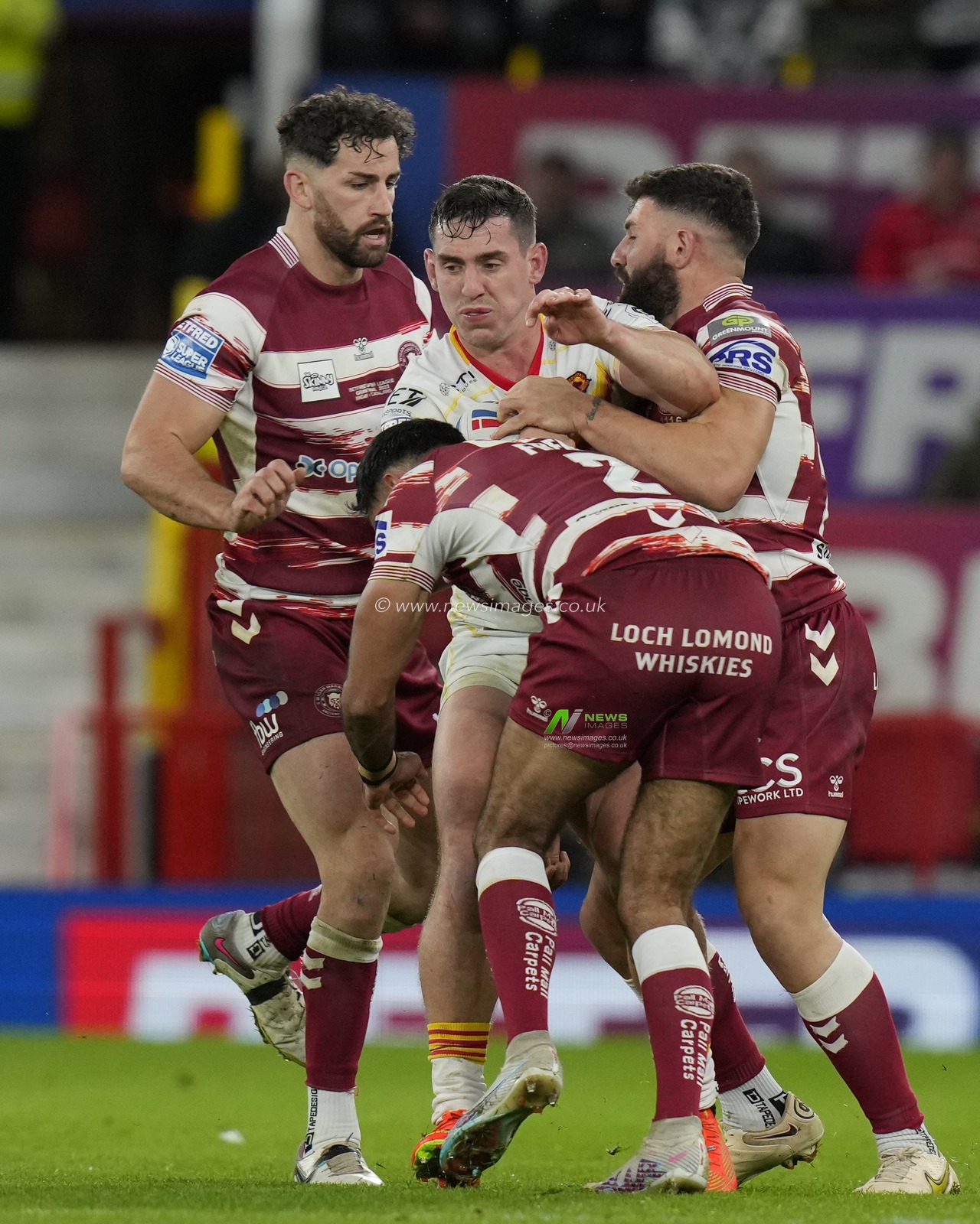Bevan French #2 of Wigan Warriors tackles Matt Whitley #11 of Catalans Dragons during the Betfred Super League Grand Final match Wigan Warriors vs Catalans Dragons at Old Trafford, Manchester, United Kingdom, 14th October 2023

(Photo by Steve Flynn/News Images)