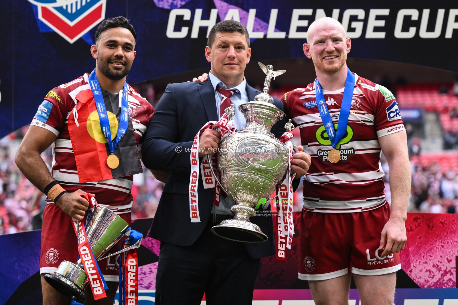 Bevan French of Wigan Warriors, Matt Peet Head Coach of Wigan Warriors and Lachlan Fitzgibbon of Warrington Wolves with the Betfred Challenge Cup trophy after the Betfred Challenge Cup Final match Warrington Wolves vs Wigan Warriors at Wembley Stadium, London, United Kingdom, 8th June 2024

(Photo by Craig Thomas/News Images)