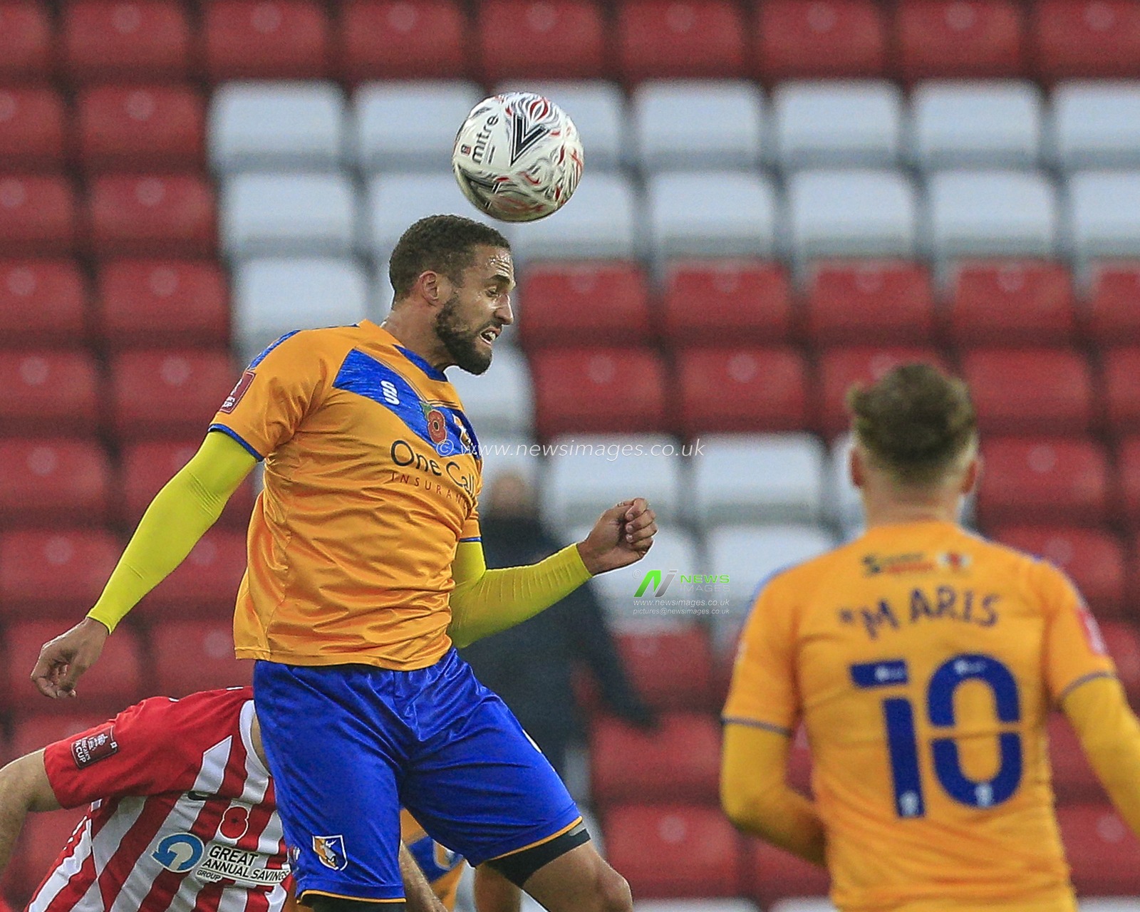 Jordan Bowery #9 of Mansfield Town heads the ball