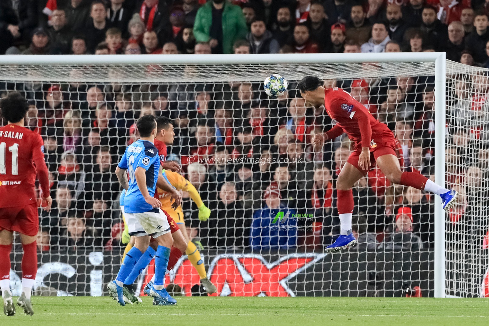 27th November 2019, Anfield, Liverpool, England; UEFA Champions League, Liverpool v Napoli : Virgil van Dijk (4) of Liverpool heads at goal but is saved

Credit: Mark Cosgrove/News Images