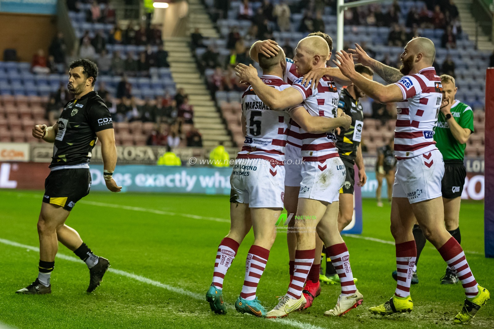 Liam Marshall #5 of Wigan Warriors celebrates scoring a try to make it 10-0
